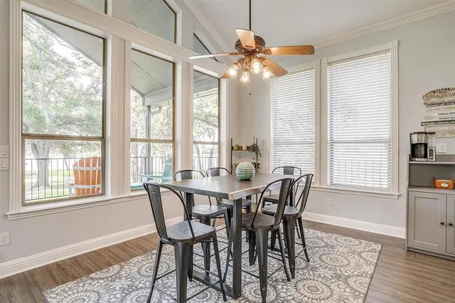 a view of a dining room with furniture wooden floor and chandelier