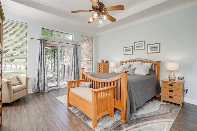 a bedroom with furniture and a wooden floor