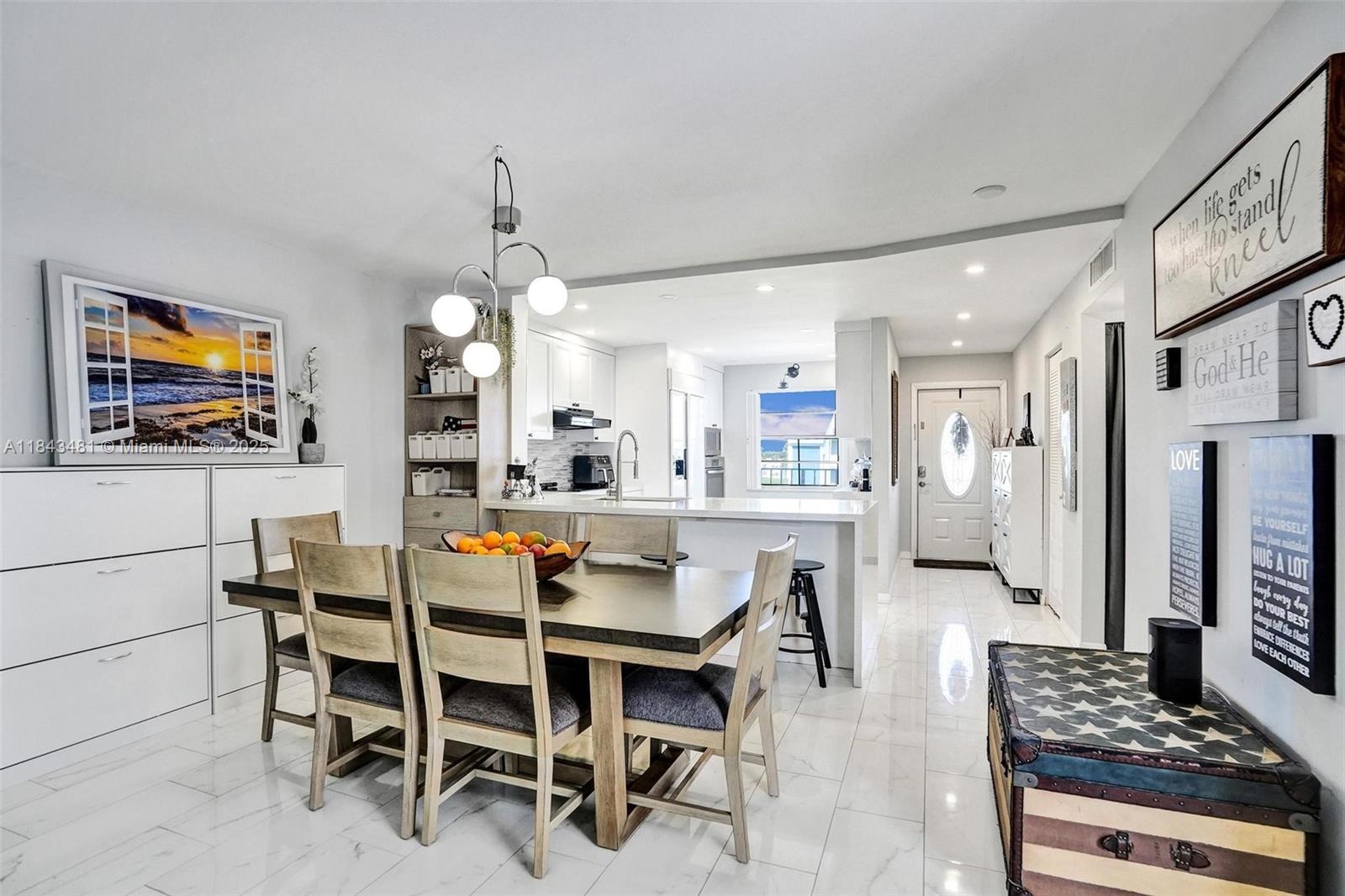 7664 Northwest 18th Street, Unit 405 Margate, FL 33063 - Photo 12 of 46 a dining room with furniture and window