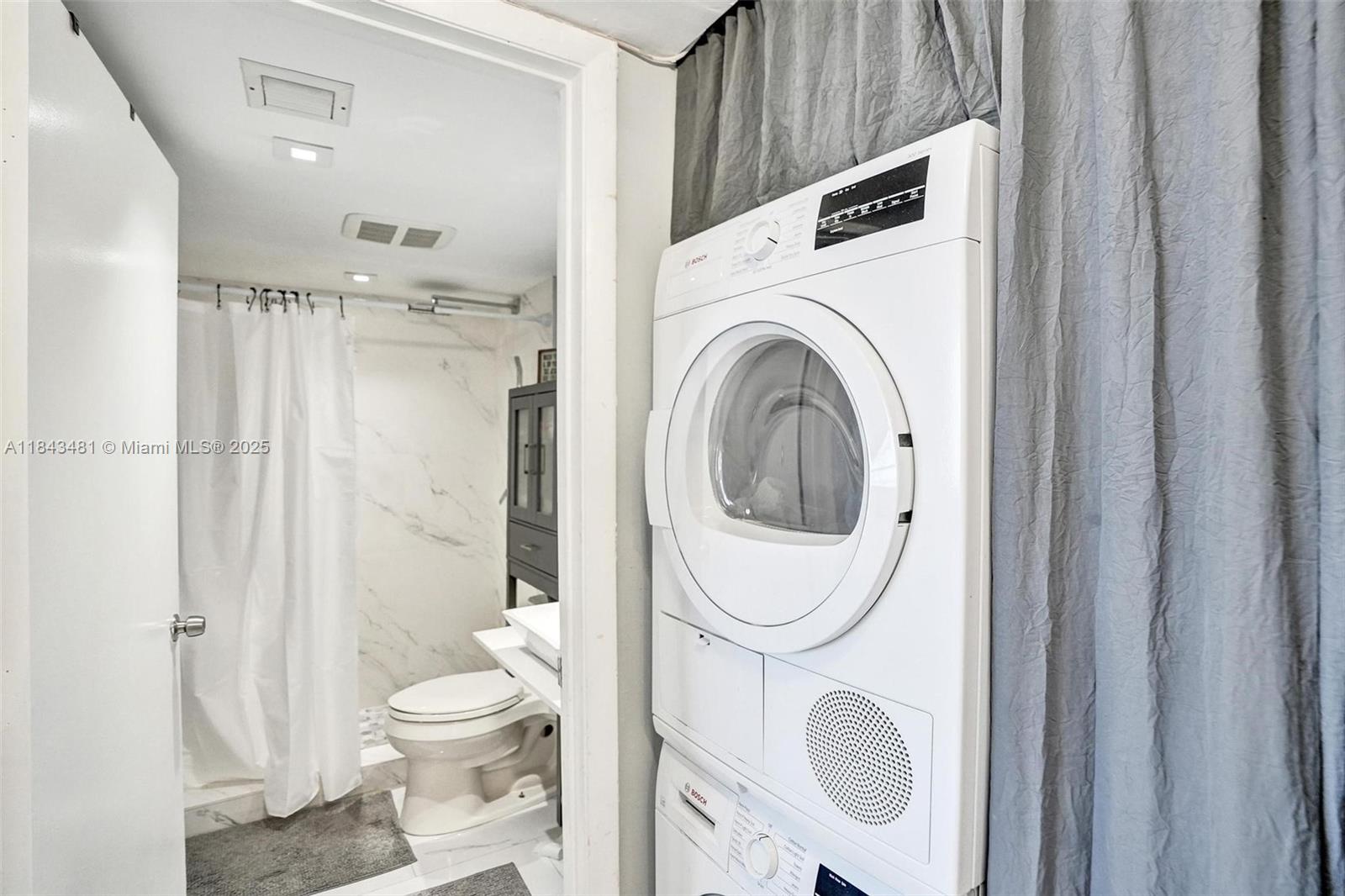 7664 Northwest 18th Street, Unit 405 Margate, FL 33063 - Photo 22 of 46 a bathroom with a toilet and a sink