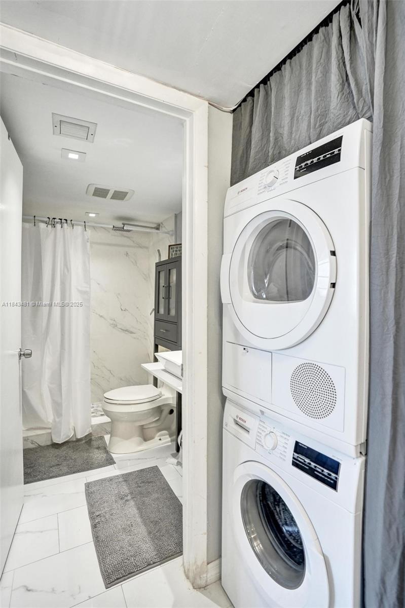 7664 Northwest 18th Street, Unit 405 Margate, FL 33063 - Photo 23 of 46 a bathroom with a sink a toilet and shower