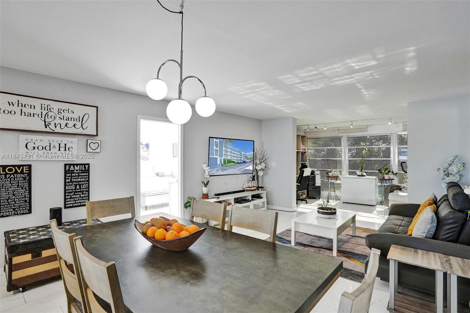 7664 Northwest 18th Street, Unit 405 Margate, FL 33063 - Photo 25 of 46 a outdoor space with furniture and view of kitchen