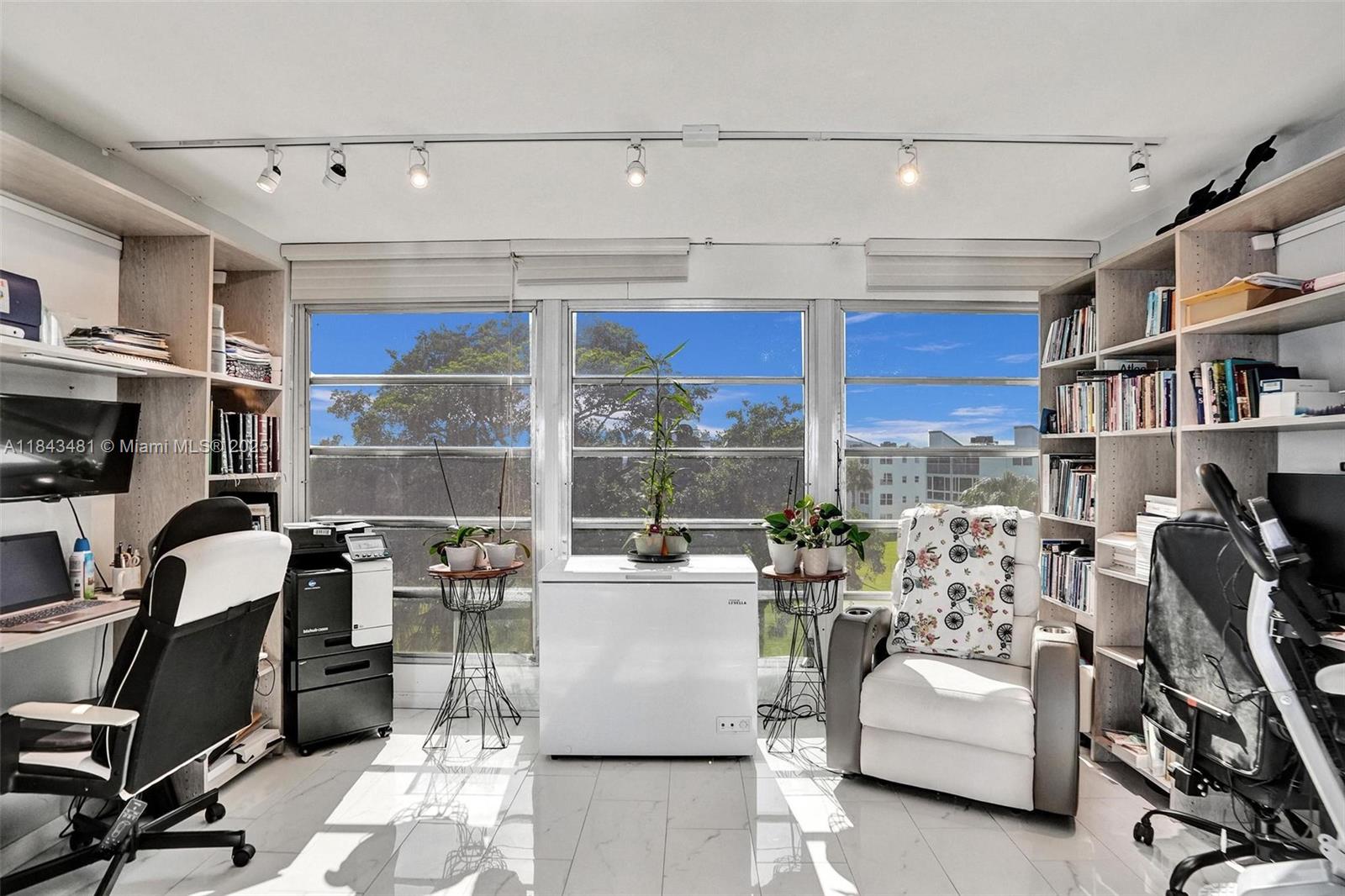 7664 Northwest 18th Street, Unit 405 Margate, FL 33063 - Photo 28 of 46 a living room with furniture a rug and a window