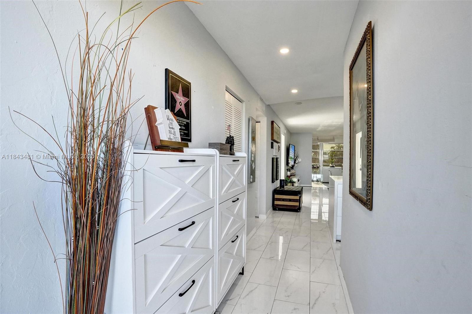 7664 Northwest 18th Street, Unit 405 Margate, FL 33063 - Photo 33 of 46 a view of a hallway with seating area