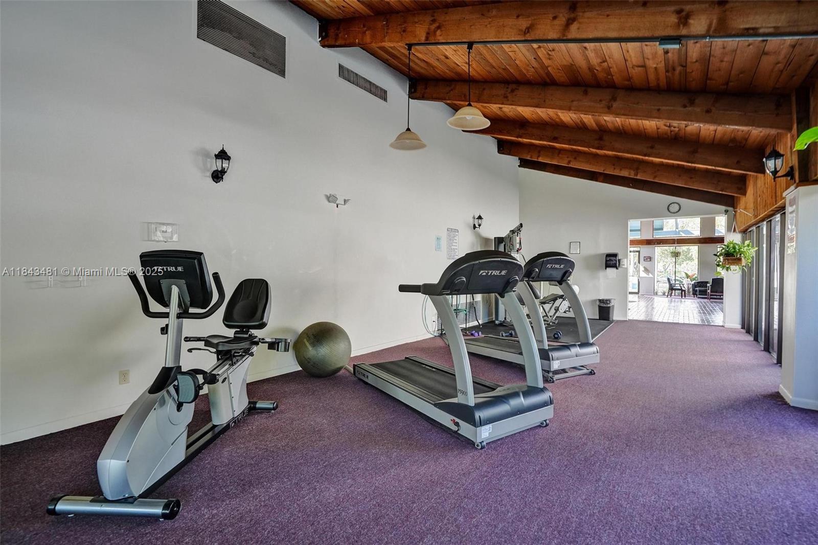 7664 Northwest 18th Street, Unit 405 Margate, FL 33063 - Photo 35 of 46 a view of a room with gym equipment