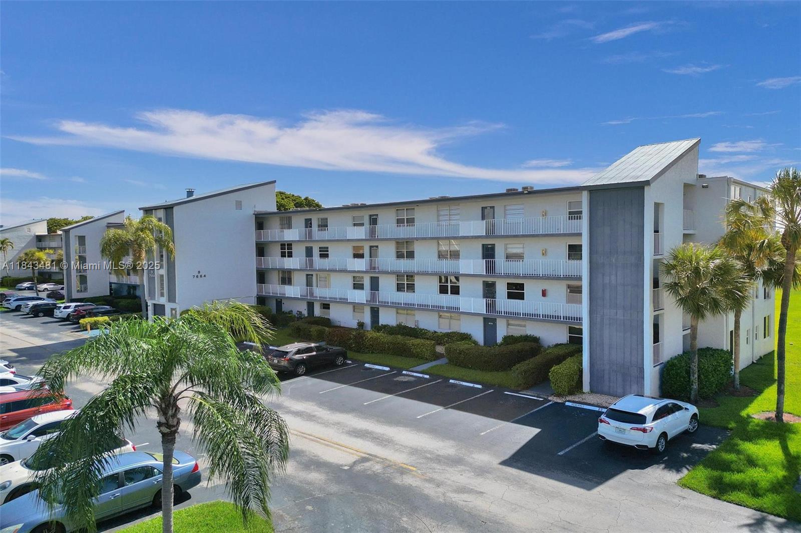 7664 Northwest 18th Street, Unit 405 Margate, FL 33063 - Photo 41 of 46 a front view of a house with a yard