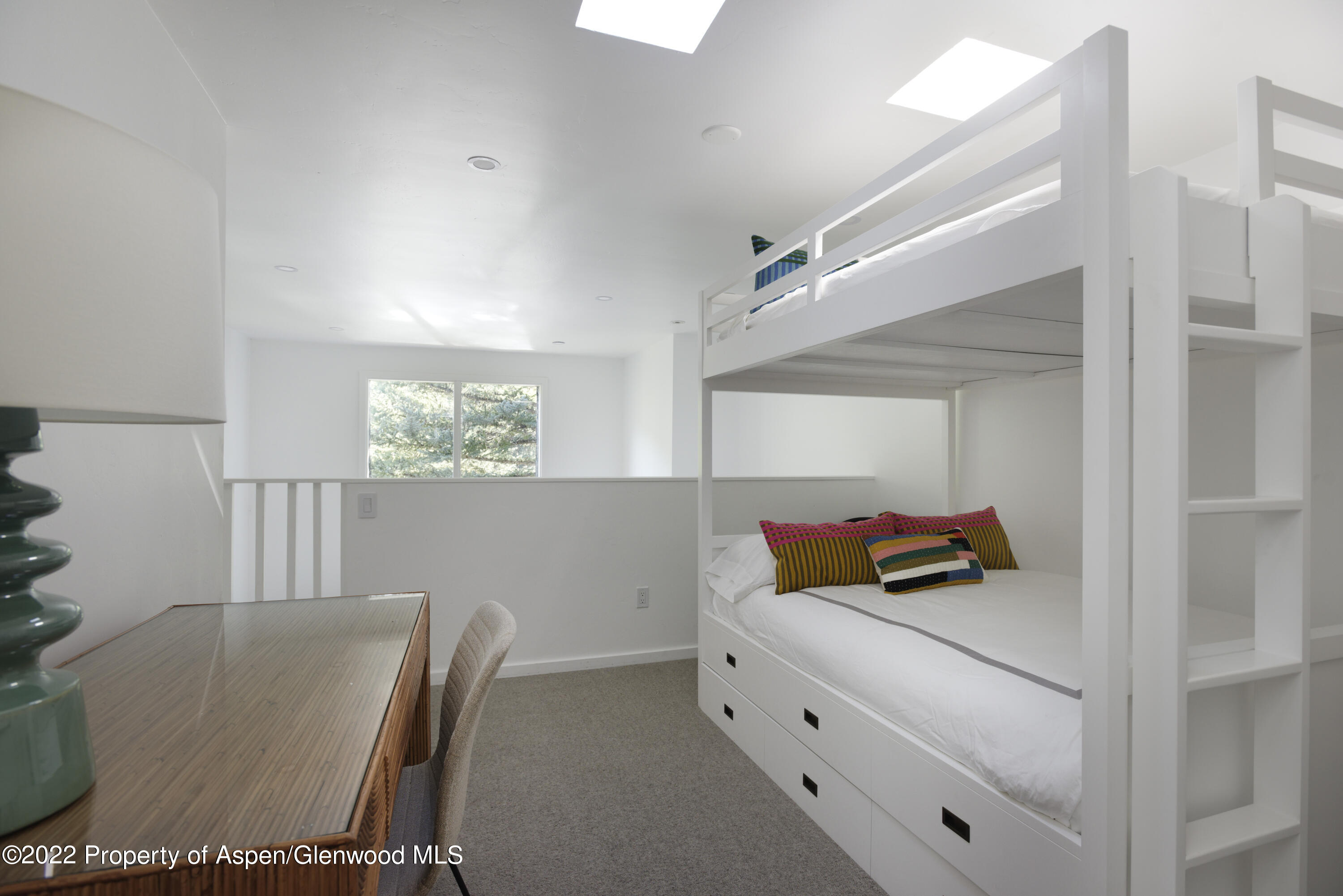 1050 Waters Avenue, Unit 14 Aspen, CO 81611 - Photo 12 of 19 a room with furniture and window