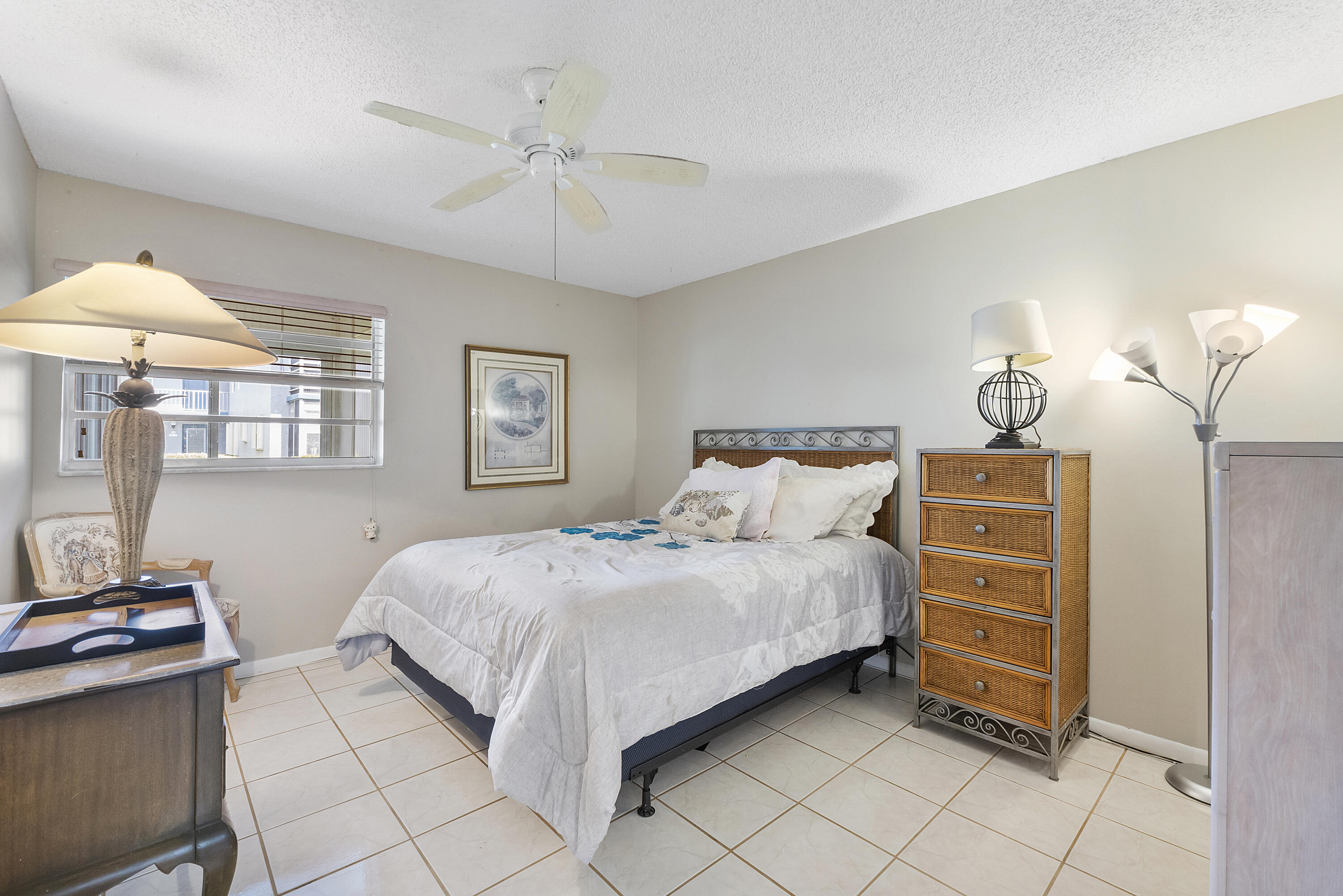 157 Flanders C Delray Beach, FL 33484 - Photo 14 of 45 a bedroom with a bed and a cabinets