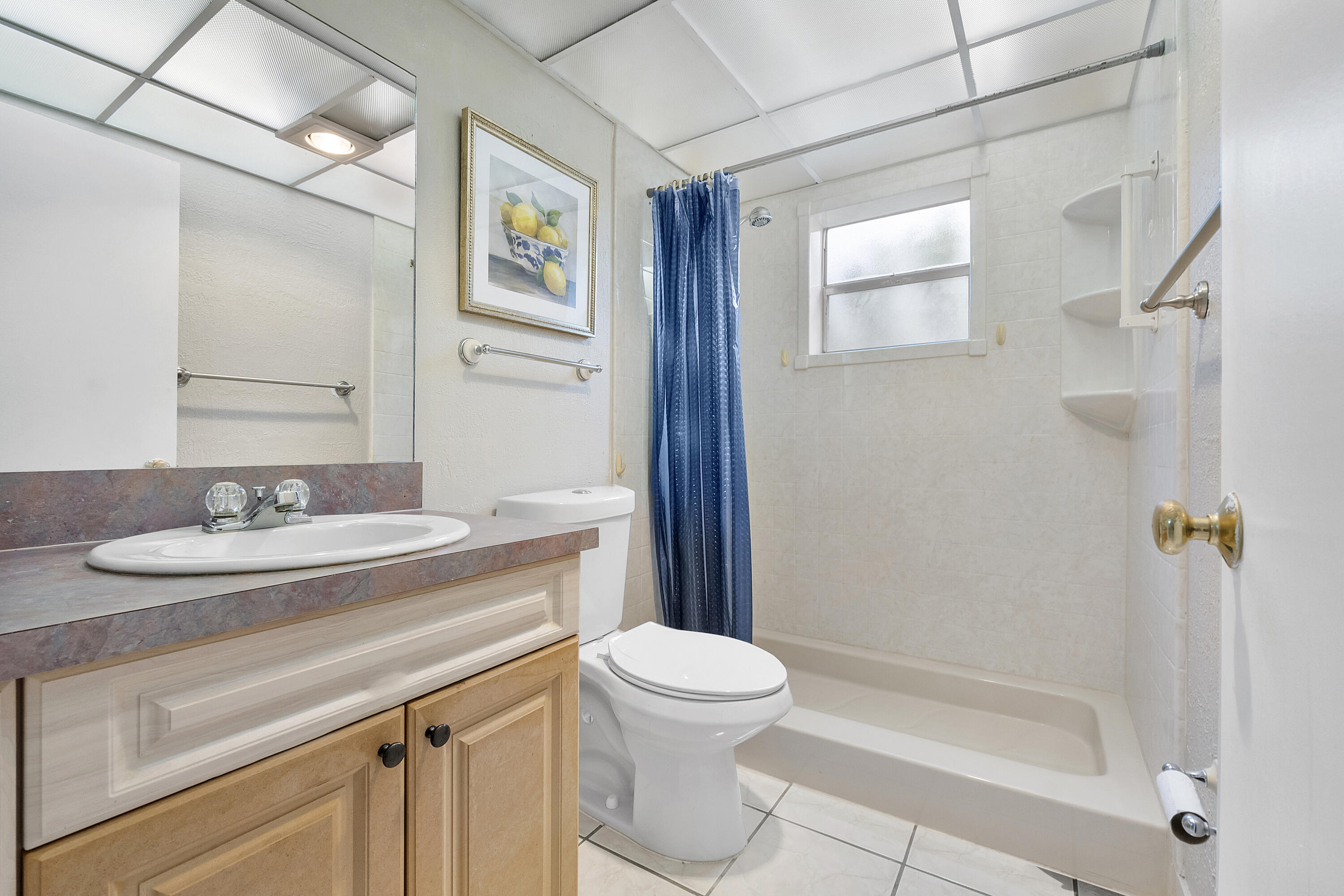 157 Flanders C Delray Beach, FL 33484 - Photo 21 of 45 a bathroom with a granite countertop sink toilet and shower