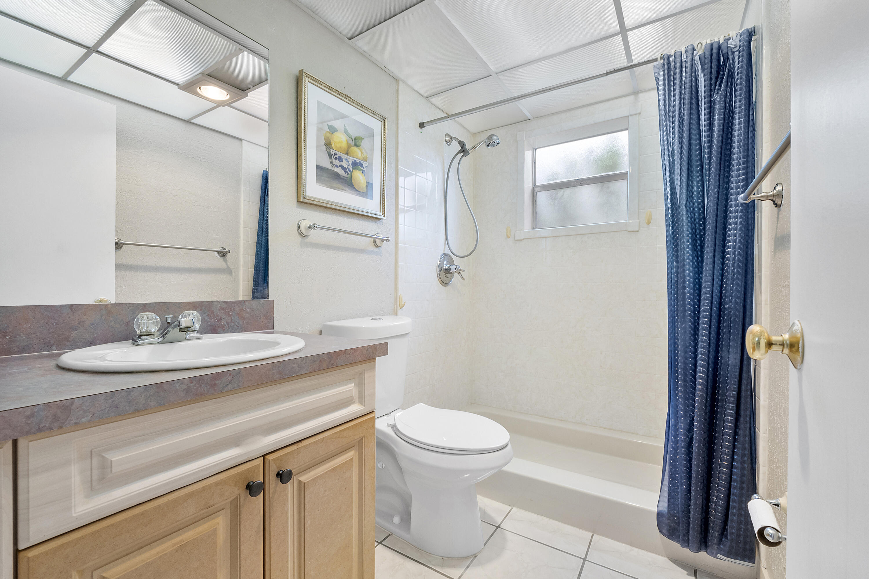 157 Flanders C Delray Beach, FL 33484 - Photo 22 of 45 a bathroom with a granite countertop sink toilet and shower