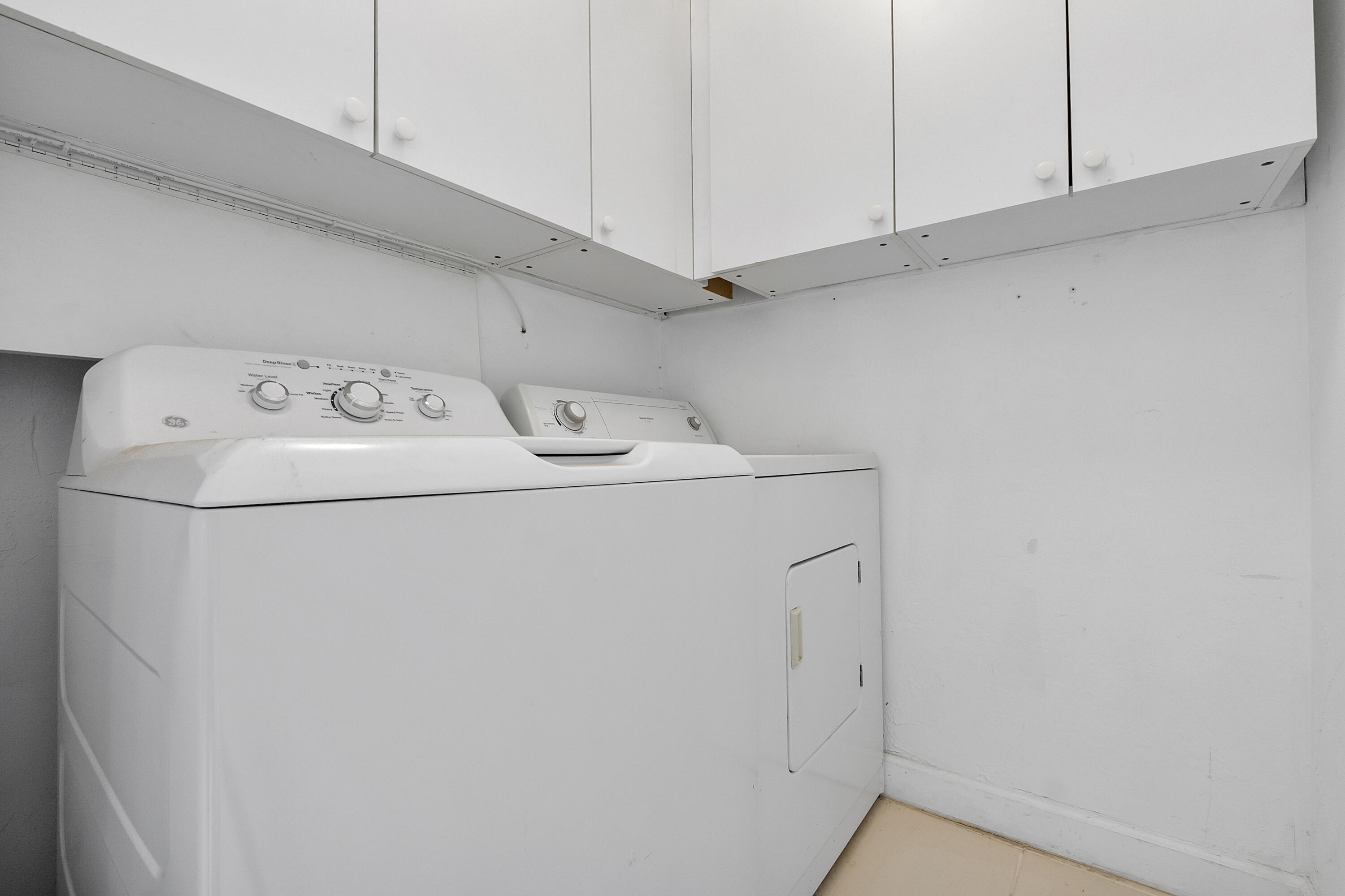 157 Flanders C Delray Beach, FL 33484 - Photo 23 of 45 a utility room with dryer and washer
