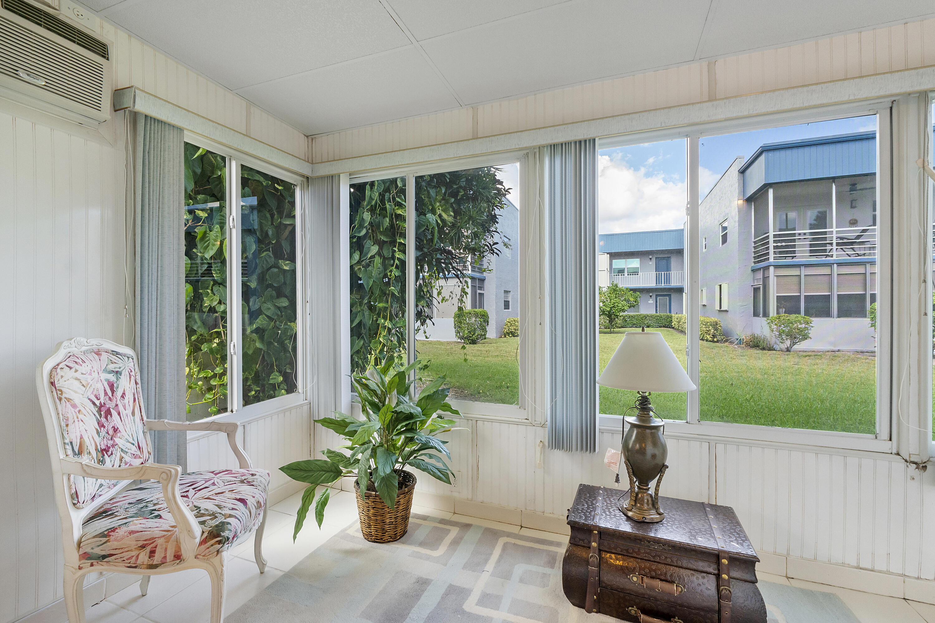 157 Flanders C Delray Beach, FL 33484 - Photo 26 of 45 a living room with furniture and garden