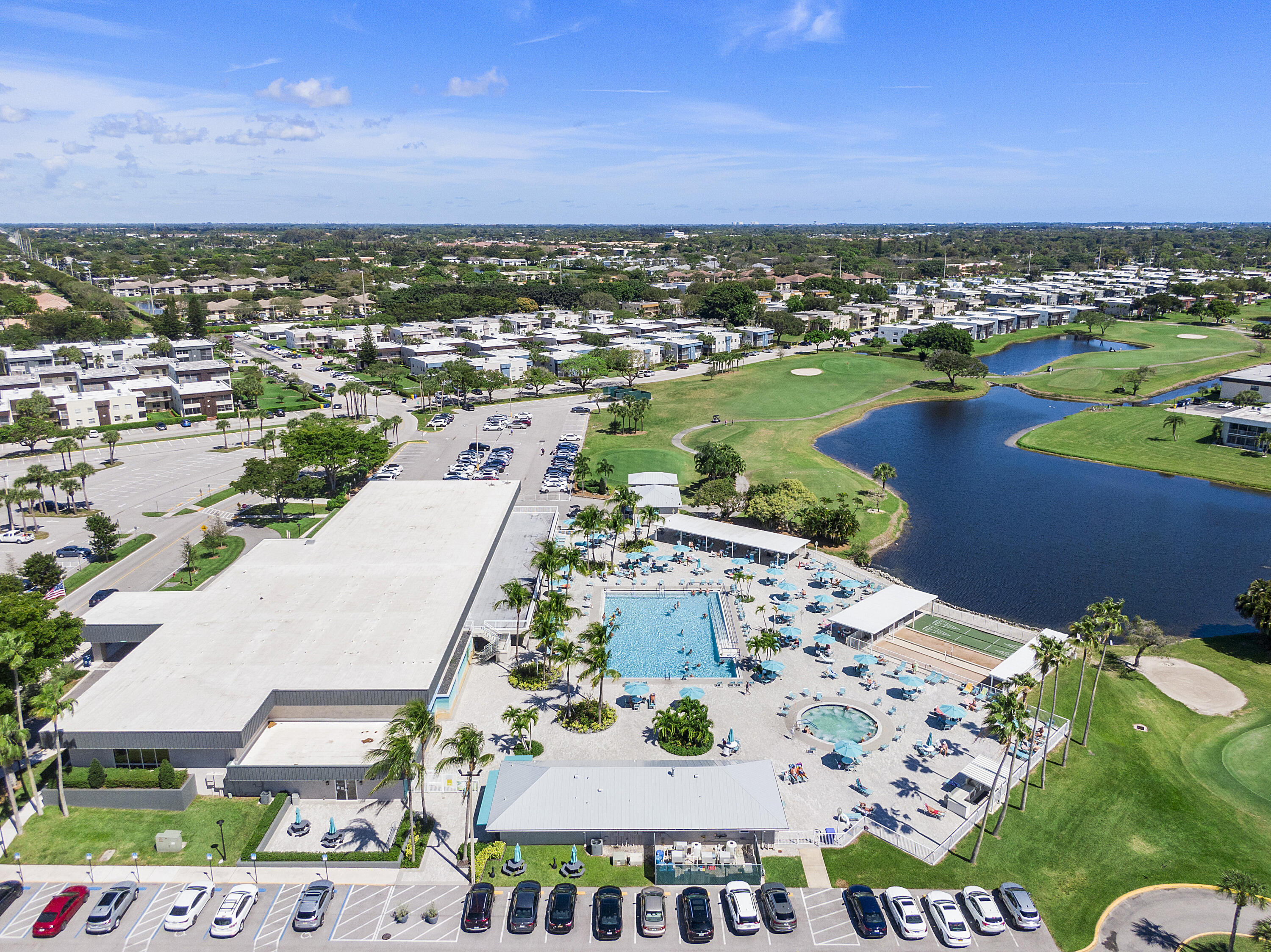 157 Flanders C Delray Beach, FL 33484 - Photo 29 of 45 an aerial view of residential houses with outdoor space