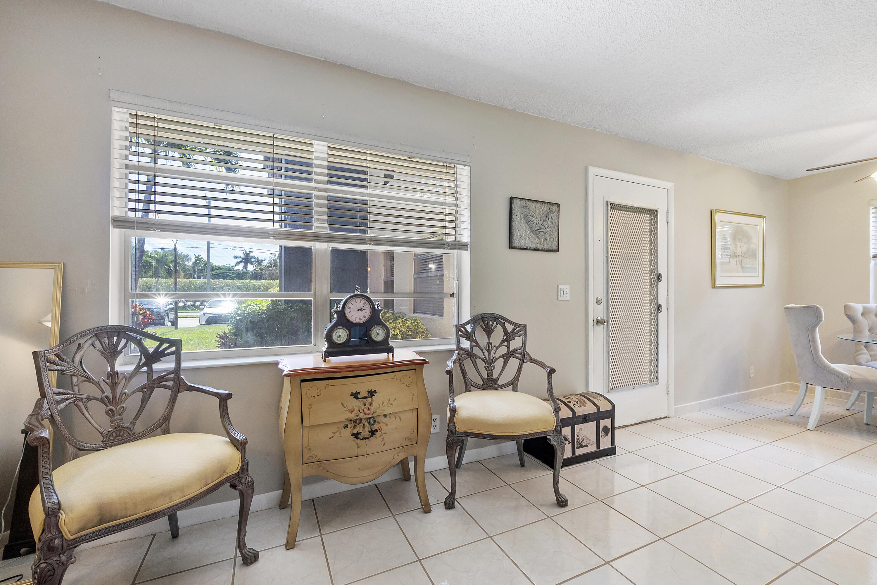 157 Flanders C Delray Beach, FL 33484 - Photo 5 of 45 a living room with furniture and a window