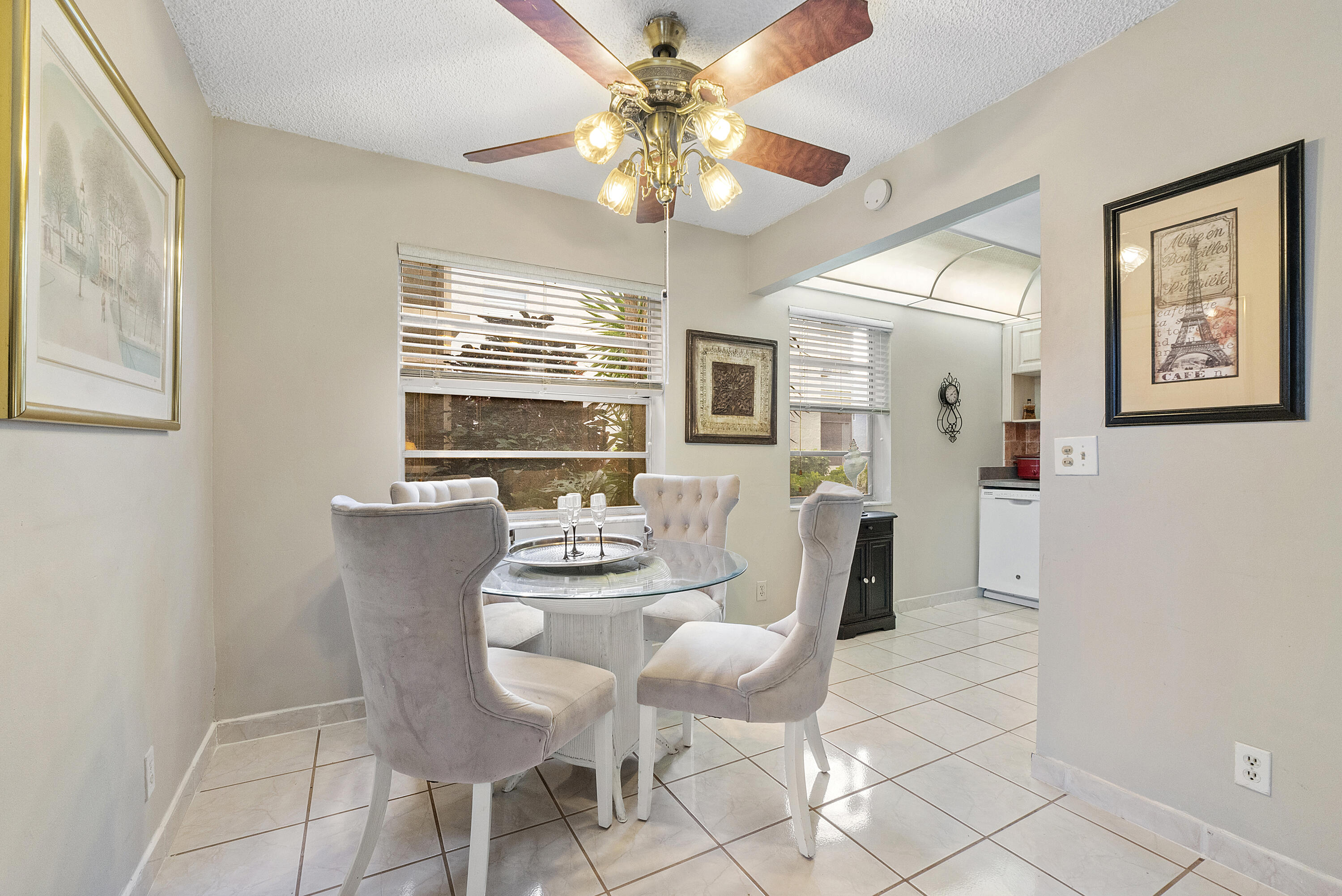 157 Flanders C Delray Beach, FL 33484 - Photo 8 of 45 a dining room with furniture and window