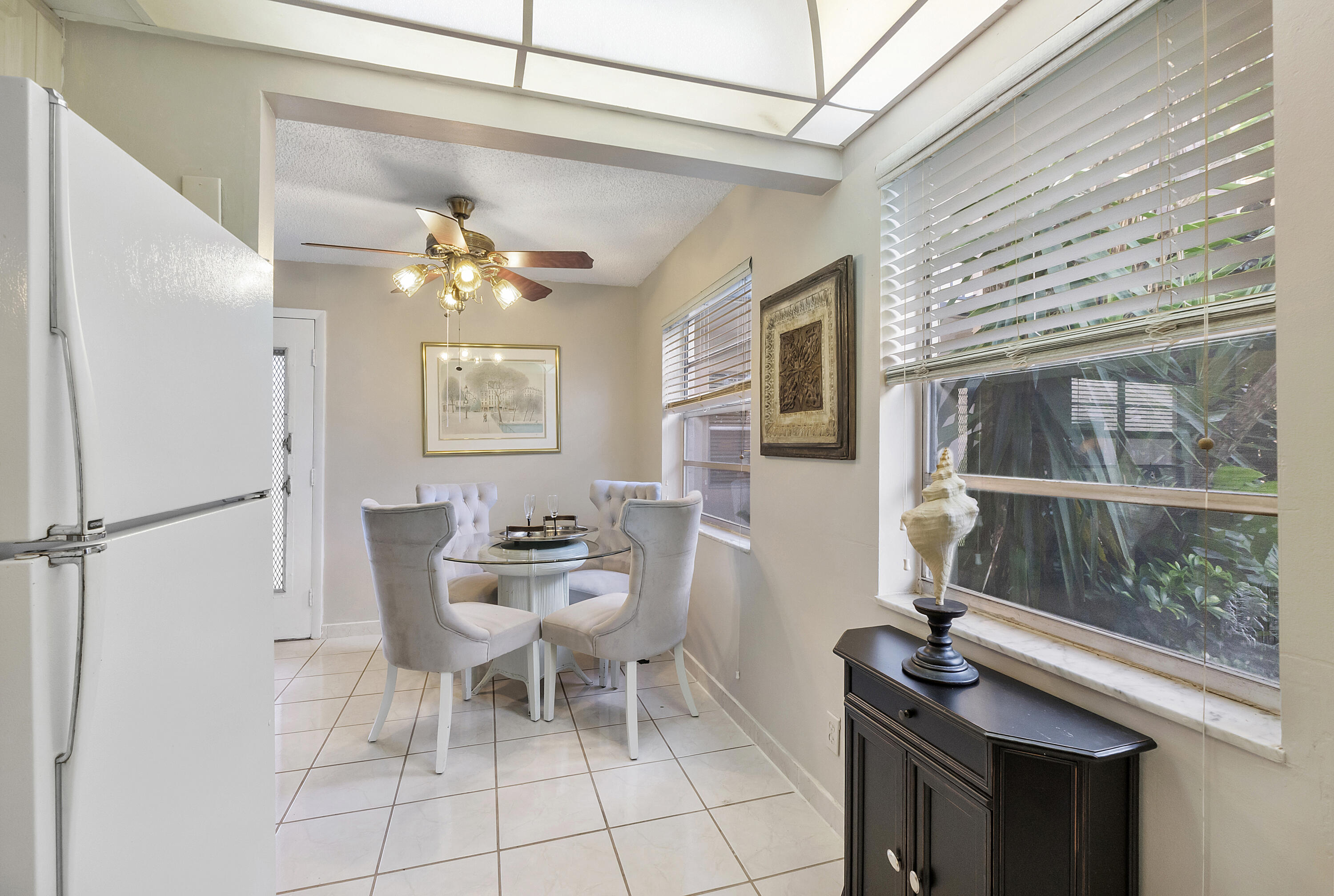 157 Flanders C Delray Beach, FL 33484 - Photo 10 of 45 a dining room with furniture and window