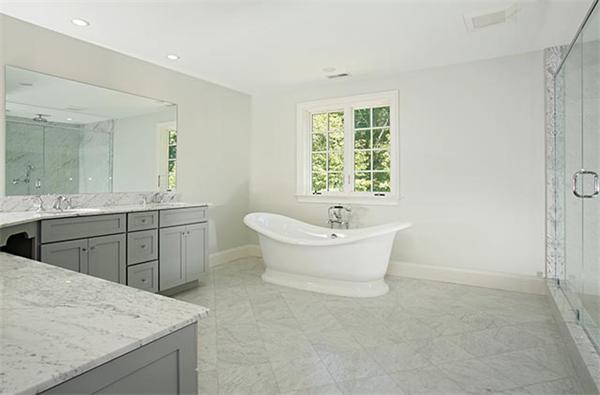 100 Wayne Road Newton, MA 02459 - Photo 11 of 14 a spacious bathroom with a granite countertop sink a toilet and mirror