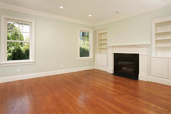 100 Wayne Road Newton, MA 02459 - Photo 2 of 14 an empty room with windows and a fireplace