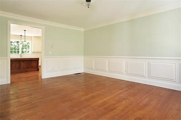 100 Wayne Road Newton, MA 02459 - Photo 3 of 14 an empty room with cabinet and windows