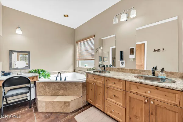 a bed room with a bed and a chandelier