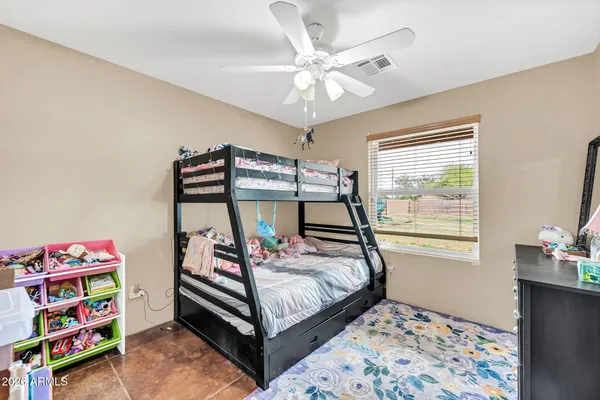 a bathroom with double vanity sinks and a mirror