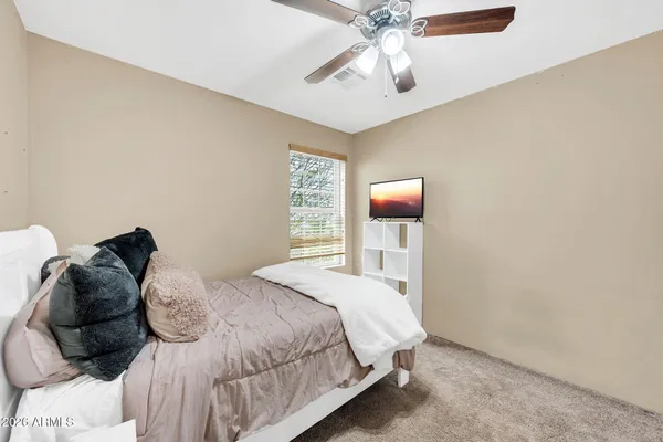 a bath tub sitting next to a white toilet
