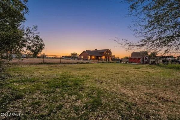 a view of a tree in front of a house