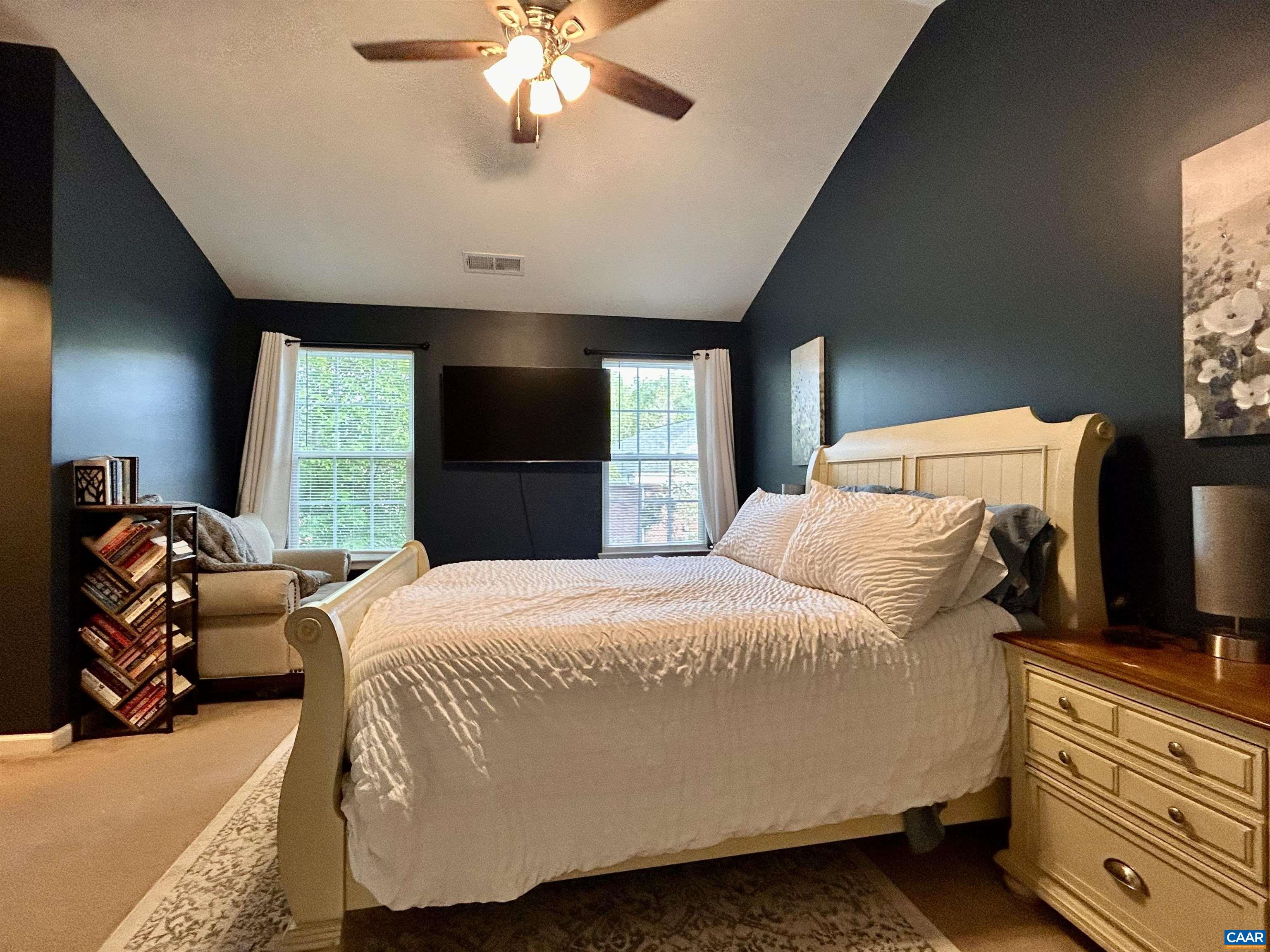 76 Villa Circle Palmyra, VA 22963 - Photo 12 of 18 a bedroom with a bed and a chandelier