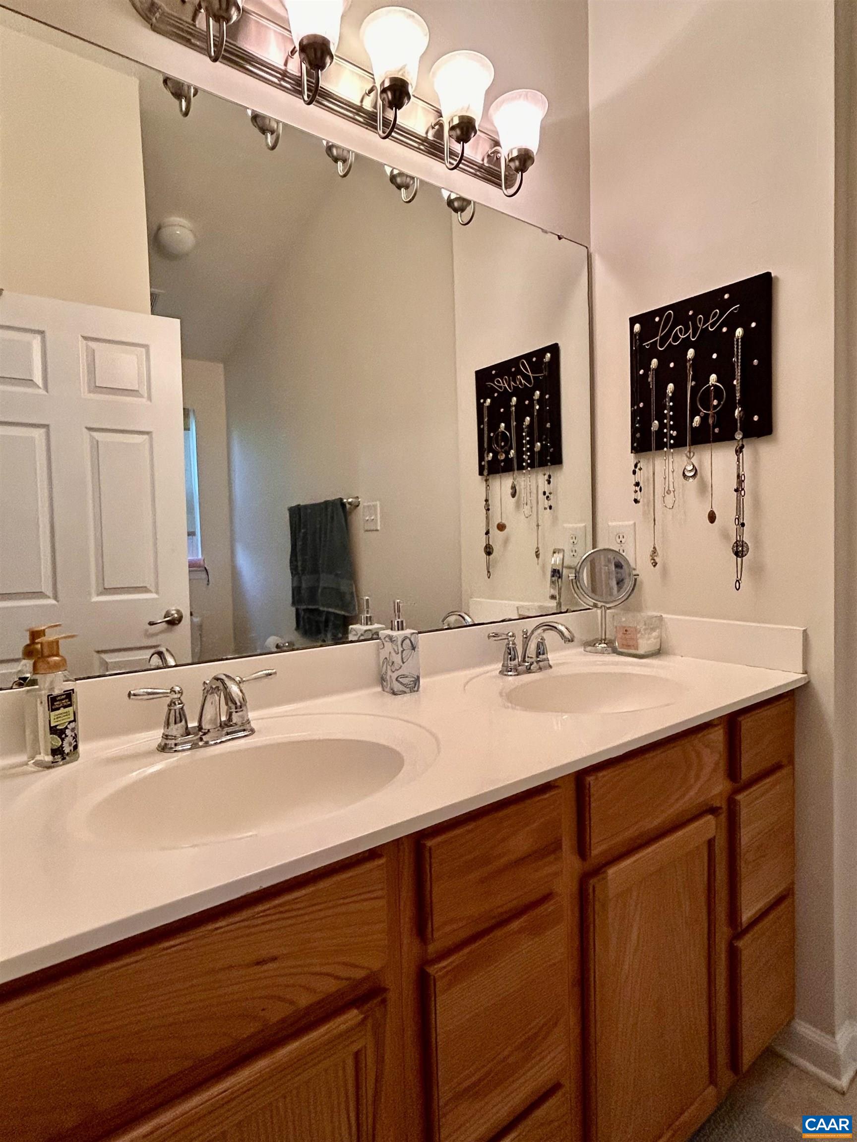 76 Villa Circle Palmyra, VA 22963 - Photo 13 of 18 a bathroom with a sink vanity and a mirror