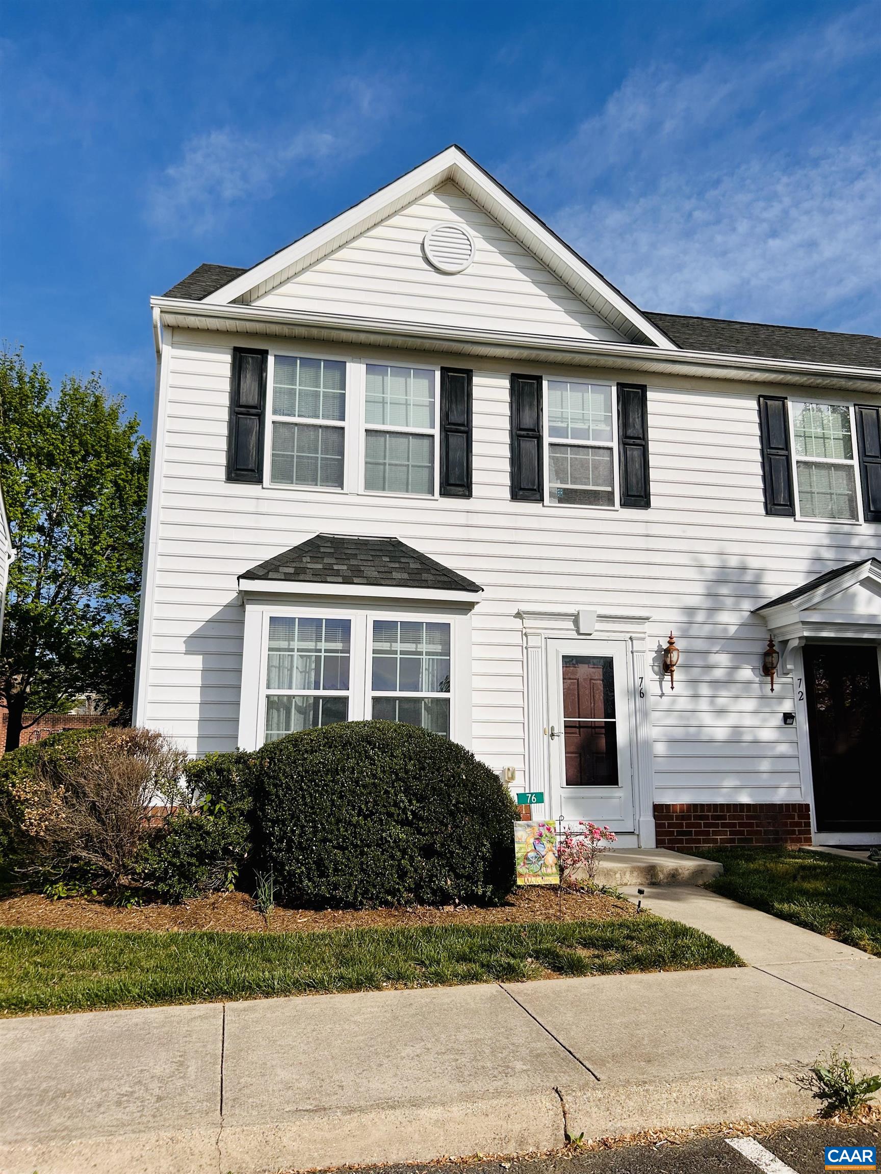 76 Villa Circle Palmyra, VA 22963 - Photo 2 of 18 a front view of a house with a yard and garage