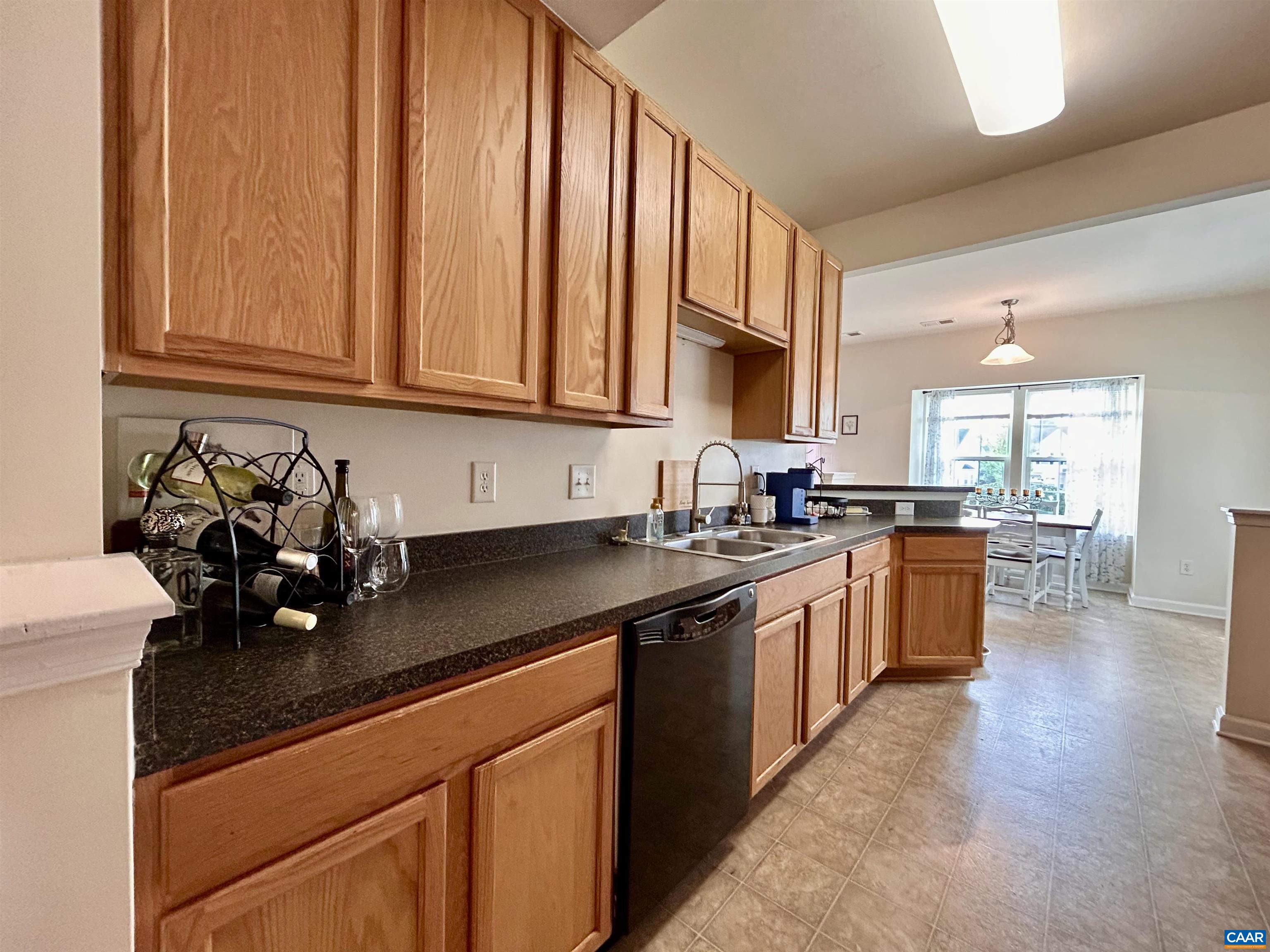 76 Villa Circle Palmyra, VA 22963 - Photo 5 of 18 a kitchen with stainless steel appliances granite countertop a sink a stove and a wooden cabinets