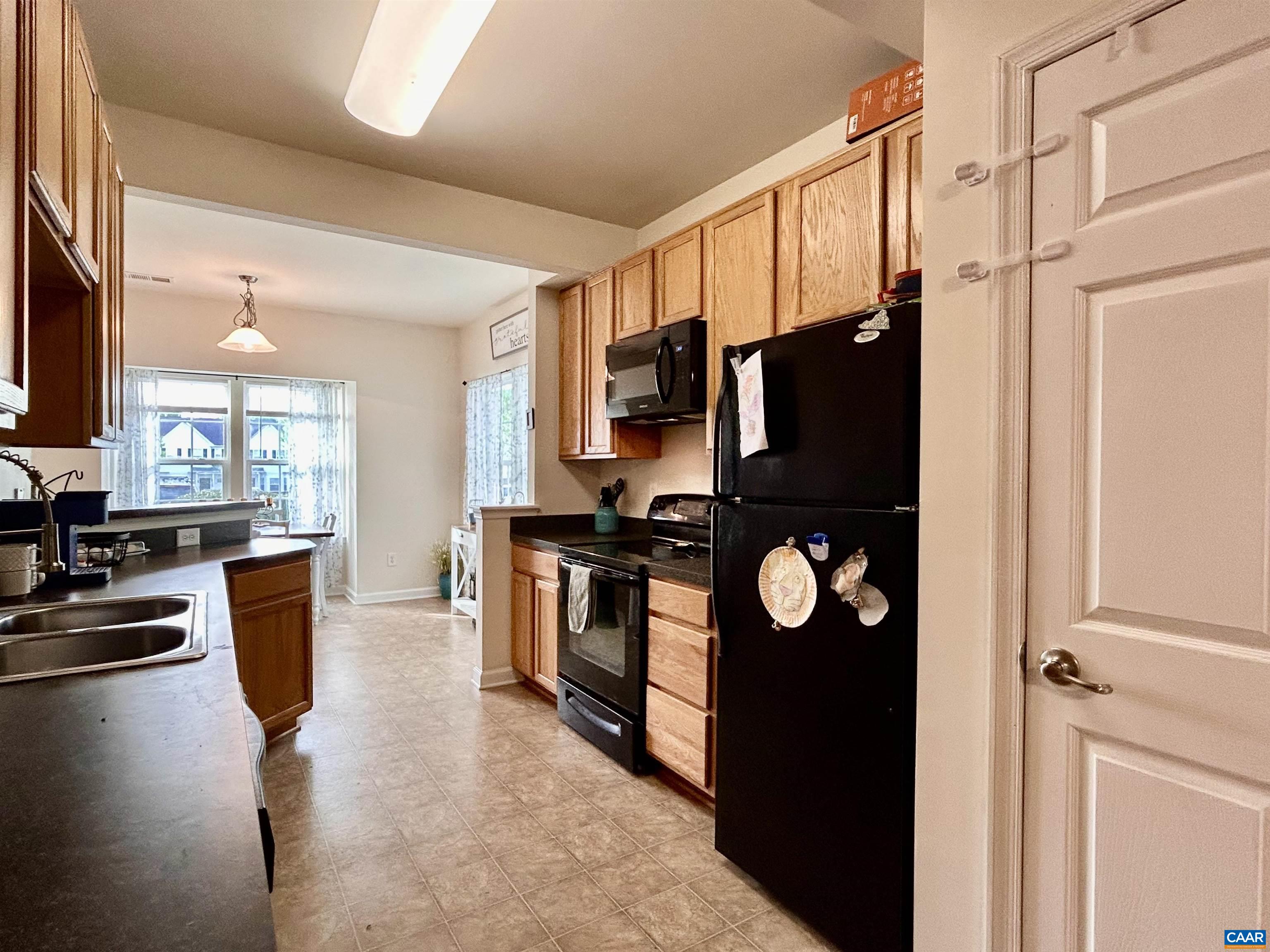 76 Villa Circle Palmyra, VA 22963 - Photo 6 of 18 a kitchen with stainless steel appliances granite countertop a refrigerator stove and sink