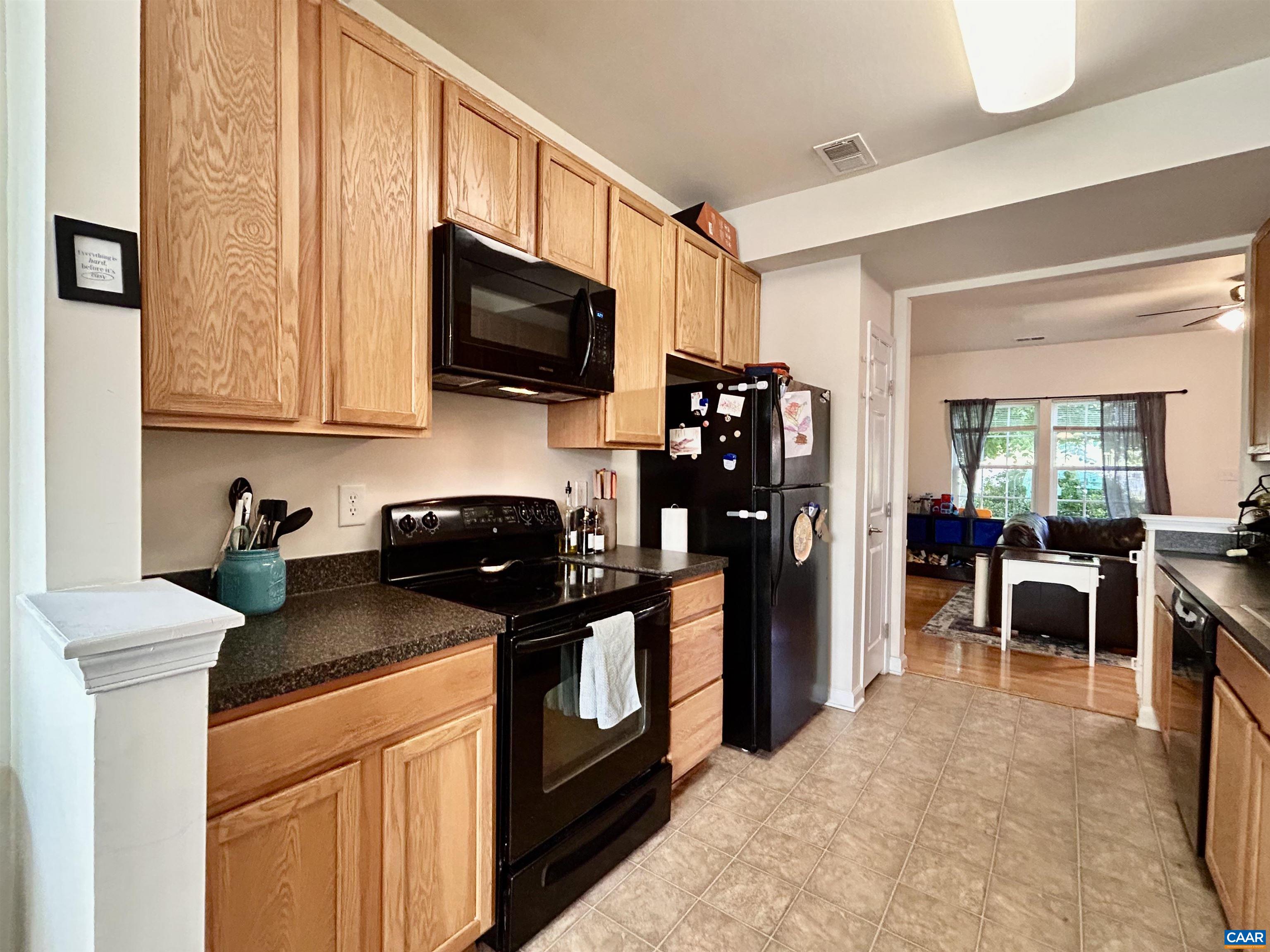 76 Villa Circle Palmyra, VA 22963 - Photo 7 of 18 a kitchen with stainless steel appliances granite countertop a stove refrigerator sink and cabinets