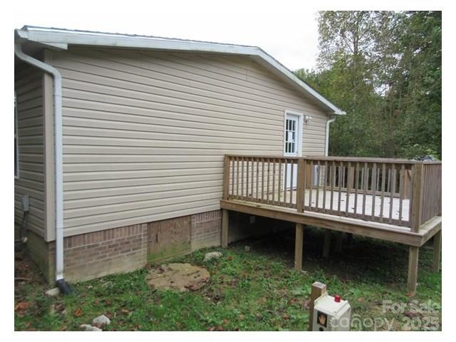 123 Josiah Lane Hendersonville, NC 28792 - Photo 10 of 13 a view of a house with backyard and deck