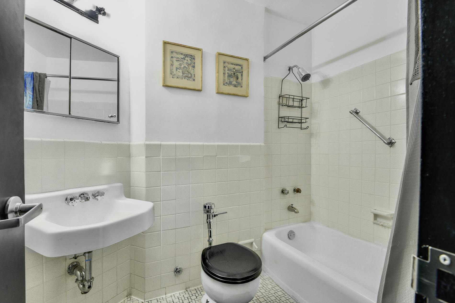 31 Jane Street, Unit 2H Manhattan, NY 10014 - Photo 4 of 10 a bathroom with a sink toilet and shower