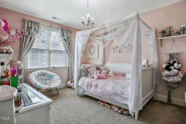 a bedroom with furniture and a window