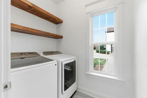 a utility room with dryer and washer