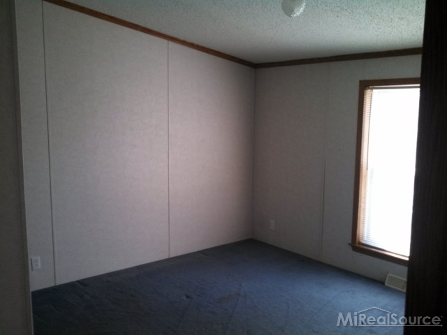 1580 Stapleton Road Goodells, MI 48027 - Photo 8 of 22 This is a view of bedroom 2.