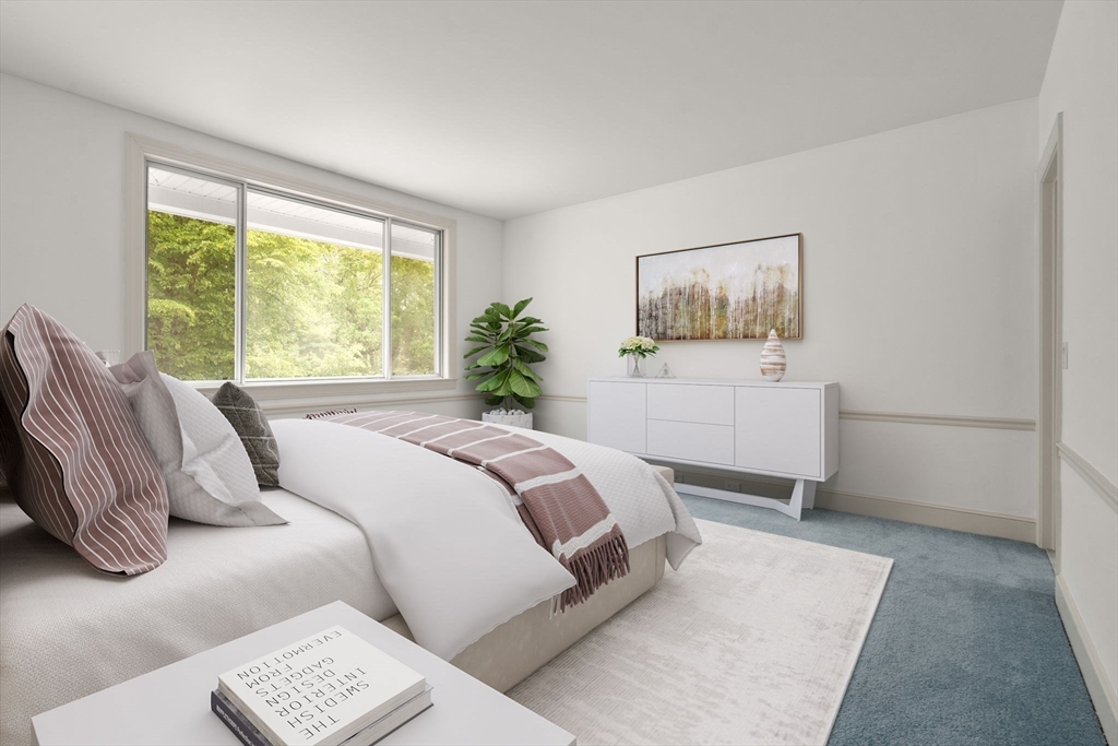204 Allandale Road, Unit A Chestnut Hill, MA 02467 - Photo 12 of 19 a bedroom with a bed and a painting on the wall