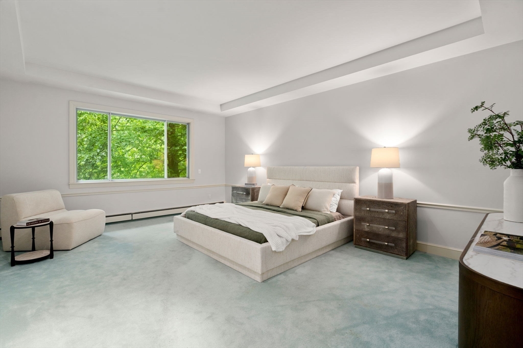 204 Allandale Road, Unit A Chestnut Hill, MA 02467 - Photo 8 of 19 a spacious bedroom with a bed and a couch