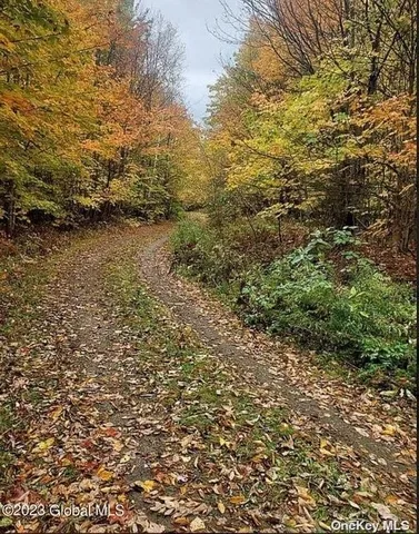 a view of residential houses and green space