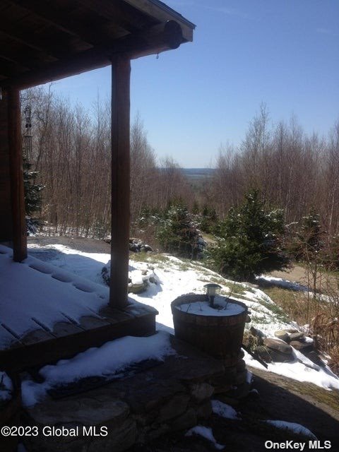 110 Stone Road Malone, NY 12953 - Photo 7 of 24 a view of a patio with table and chairs with wooden fence