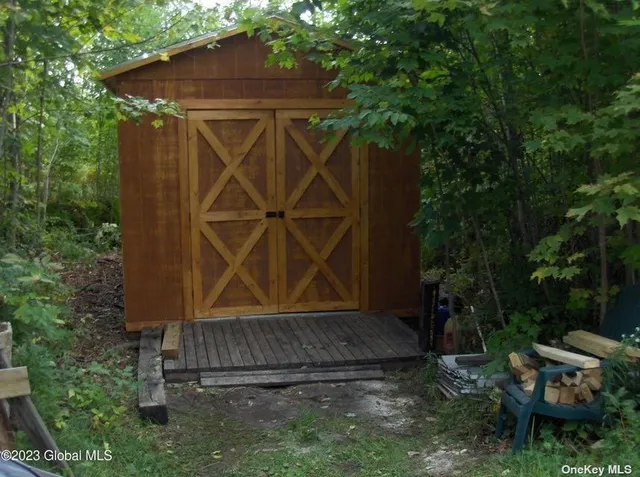 a view of house with backyard and garden