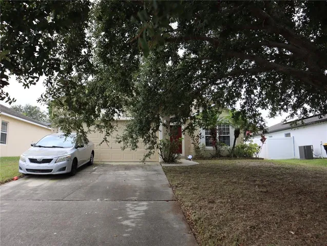 a view of a yard with car parked