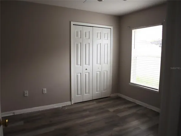 a white toilet sitting next to a shower