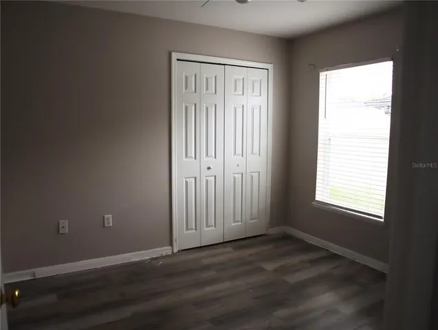 a white toilet sitting next to a shower