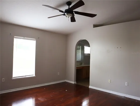 a kitchen with a stove a microwave and cabinets
