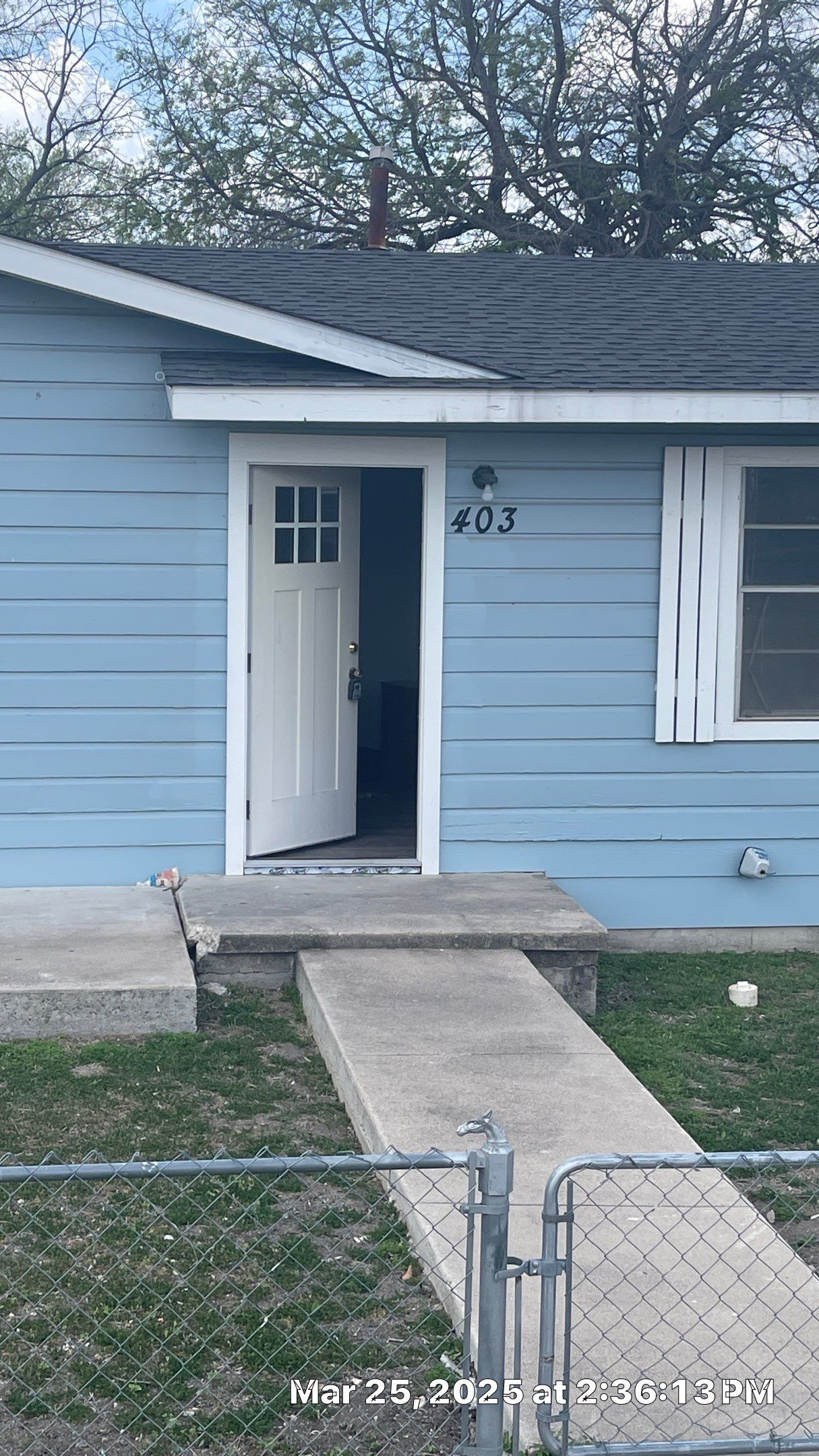 403 North 1st Street Copperas Cove, TX 76522 - Photo 1 of 1 View of exterior entry featuring a gate and a shingled roof