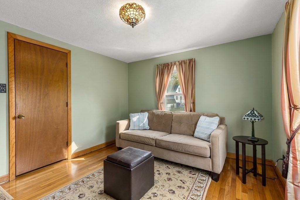 3 East Street Springfield, MA 01104 - Photo 12 of 29 a living room with furniture and a window