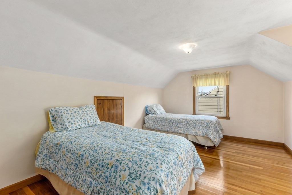 3 East Street Springfield, MA 01104 - Photo 15 of 29 a bedroom with two beds and wooden floor